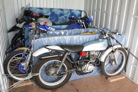 Transport a motorcycle in a shipping container