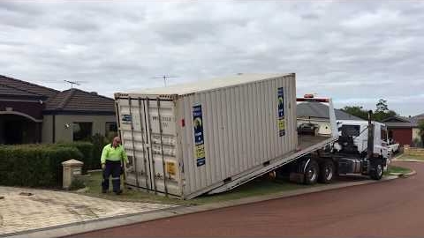 Watch Video : Unloading a self pack moving container onto a verge