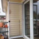 View Photo: Double glazed French doors with stainless steel bifold flyscreen