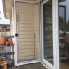 Double glazed French doors with stainless steel bifold flyscreen