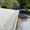 Grayson’s ScrewTight Full-Metal gutter guard on corrugated roofing in Victorian bush.