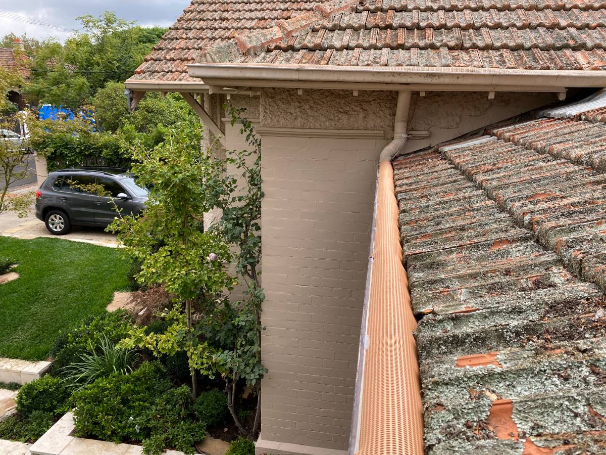 View Photo: Triple-G gutter guard on a tiled terracotta roof