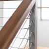 Timber handrail on staircase balustrade