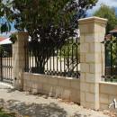 View Photo: LImestone and Decorative Wrought Iron Fence and Gate
