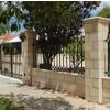 LImestone and Decorative Wrought Iron Fence and Gate